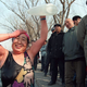 Xiao Rung, 66, of Beijing rinses off with bottled tap water after celebrating International Women’s Day with a winter swim in a central Beijing lake on March 8. She joined several other women residents. The water temperature was 2 °C.